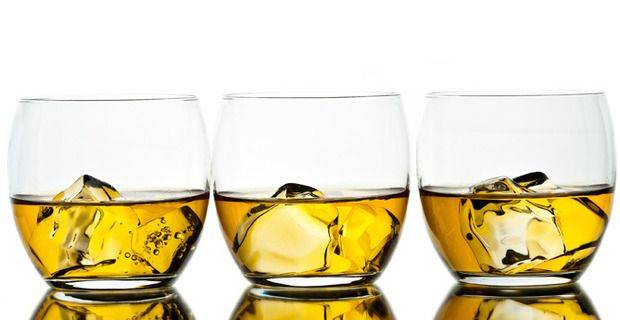 Three Glasses of Whisky on Ice Closeup